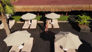 A girl walks into the pool. High quality FullHD footage