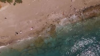 Calm sea with white sand. The sun shines on the water. High quality FullHD footage
