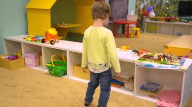 Child playing with toys at home. High quality FullHD footage