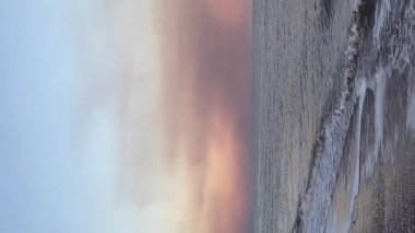 Mariupol, Ukraine - 04.10.2022: Huge amount of smoke from destroyed Mariupol against the background of the sea. High quality FullHD footage