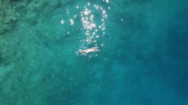 A girl swimming in a white swimsuit in Turkey. High quality FullHD footage