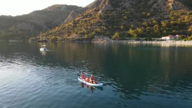 Beauty family swimming on blue canoe in Oludeniz, near Blue Lagoon. High quality 4k footage
