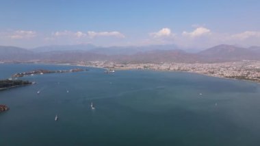 Sea in Fethiye, yachts with sails. Aerial view on city. High quality 4k footage
