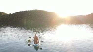 Beautiful landscape on family with blue canoe on Fethiey. Big mountains, hotels and Blue Lagoon. High quality 4k footage