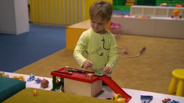 Boy Yellow Shirt Plays Toys High Quality Fullhd Footage — 비디오