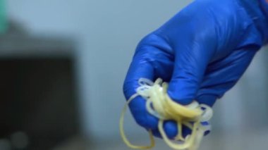 An onion slices of cutlet is placed on a hamburger patty, tasty junk meal.. High quality FullHD footage