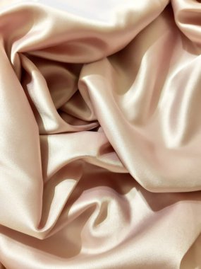 Saten, ipek yüzey, iç çamaşırı, kadın kıyafeti. Arkaplan tasarımı, fotoğrafçılık, hassas kumaş. Tekstil, kumaş şablonu, modern 