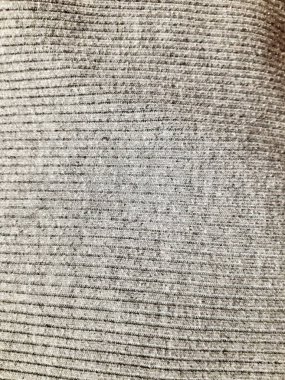 Gri, sıcak örülmüş kumaş. Arkaplan tasarımı, fotoğrafçılık. Tekstil, kumaş şablonu, modern yeni