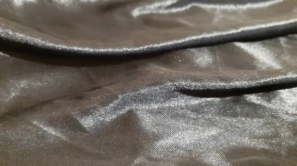 Siyah, karanlık, lüks bir yüzey. Arkaplan tasarımı, fotoğrafçılık. Tekstil, kumaş şablonu, modern yeni