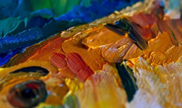 Texture of oil paints close-up. Strokes made with a palette knife in yellow and blue tones