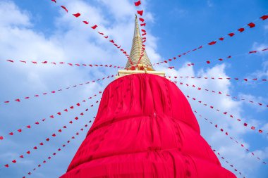 Golden buddha, red background, Wat Saket, Bangkok, Thailand clipart