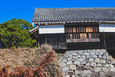 Damaged buildings in Kumamoto Castle, after the Kumamoto earthquake clipart