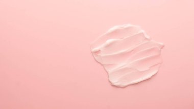 Skincare cream smear on pink background. Cosmetic lotion swatch texture of face cream, body moisturiser and hair conditioner. Banner or template for beauty and cosmetic product. clipart