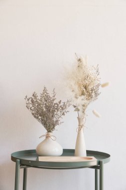 Dried flowers in a vase on the table