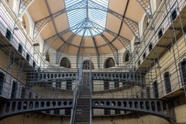 DUBLIN, IRELAND - 25 MARCH 2023: The Central Atrium at Kilmainham Gaol Museum. This is used in the 1969 film The Italian Job.  clipart