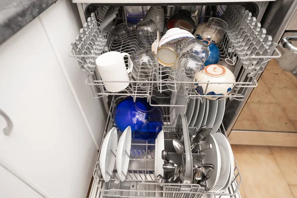 Woman use dishwasher machine for housework