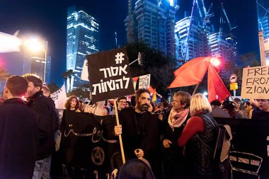 TEL AVIV, ISRAEL - January 21, 2023: Israelis protest in Tel Aviv against plans by prime minister Benjamin Netanyahu new government to trample the legal system and the supreme court. High quality clipart