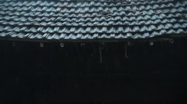 Raining on roof of village house