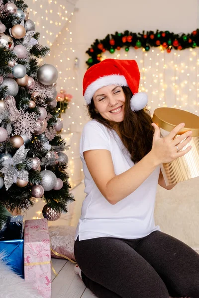 Young Woman Joyfully Opens Christmas Present New Year Gift Merry — Stock Photo, Image