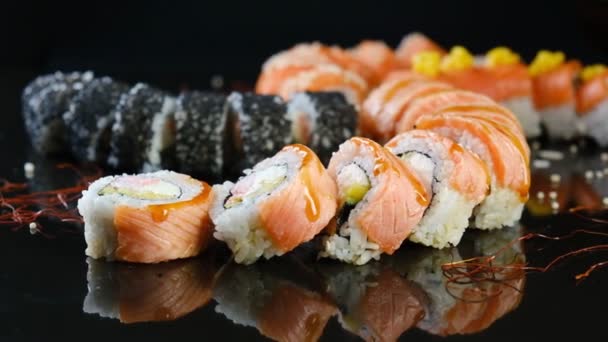Sushi Set Black Background Fresh Variety Rolls Japanese Restaurant Eastern — Stock video