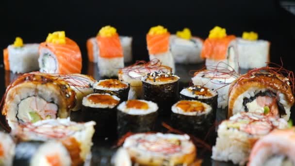 Sushi Set Black Background Fresh Variety Rolls Japanese Restaurant Eastern — Stock Video