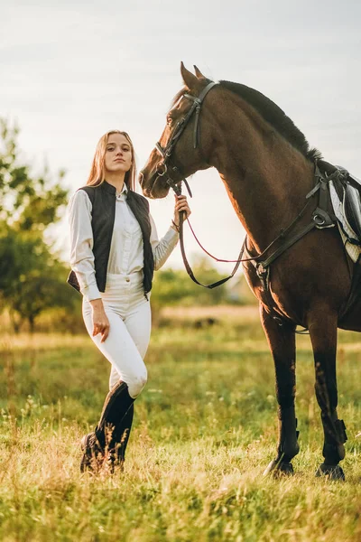 Young Beautiful Female Jockey Strokes Hugs Horse Head Prepares Competition — Stock Fotó