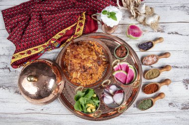 Lamb ribs on bulgur pilaf. Stuffed Ribs isolated on black background. Turkish name; 
