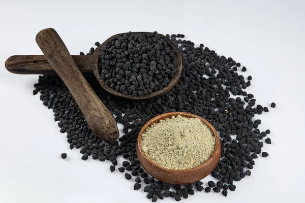 Black ceci neri chickpeas are very healthy to be consumed with their high fiber content. Heap of black Ceci neri chickpeas, black chickpea flour in a bowl with on white background.