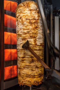 Traditional turkish foods, chicken doner kebap in Istanbul, Turkey. Doner kebab (also doner kebab) is a type of kebab, made of meat cooked on a vertical rotisserie.