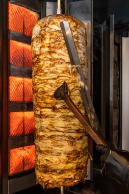 Traditional turkish foods, chicken doner kebap in Istanbul, Turkey. Doner kebab (also doner kebab) is a type of kebab, made of meat cooked on a vertical rotisserie.