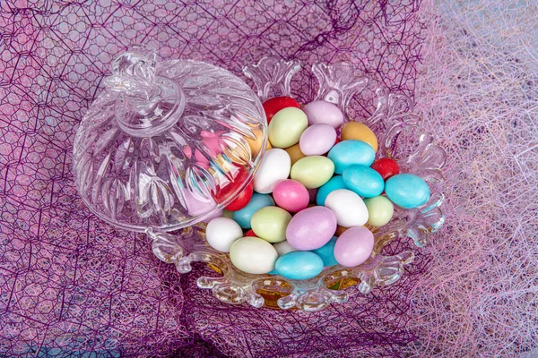 Almond candies.Colorful candies in glass bowl served with tea; almond sweets. Sugar Feast, (Feast of Ramadan) Ramadan concepts.