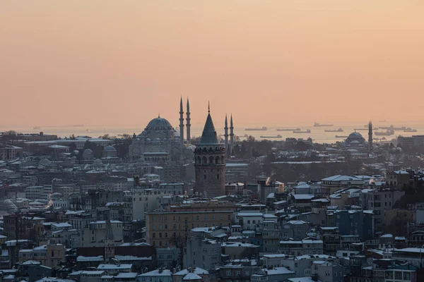 stock image Galata tower in Istanbul, Turkey. Aerial view of landmark at golden hour with beautiful sunlight. Snow and winter season view in Istanbul Suleymaniye Mosque and Galata tower.