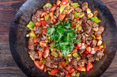 Meat Saute Turkish et sote with wood table - Hair Pie Meat - Sac Tava - Sac Kavurma