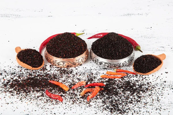 Black hot pepper spice. Chili pepper is a hot spice obtained by drying the pepper in the sun. Pounded and dried peppers isot used in turkish cuisine. Dry spice concept. local name isot.