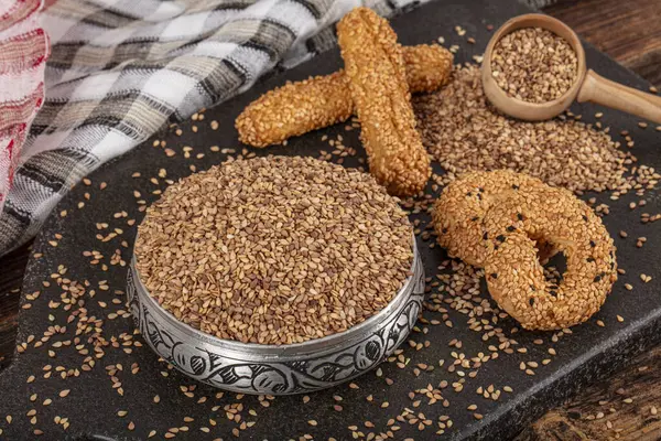 Roasted sesame seed. Pile of sesame seeds as background, spice or seasoning as background. Close-up Sesame seeds.