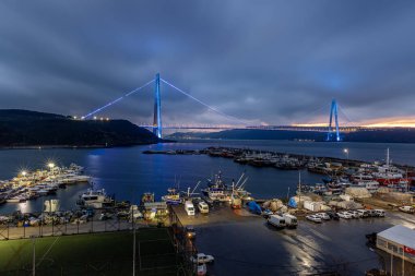 Yavuz Sultan Selim Bridge in Istanbul, Turkey in evening illumination. 3rd Bosphorus Bridge night view from Poyraz. clipart