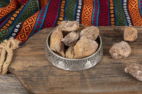 stock image Tasty dried figs on wooden table. Delicious dried figs in a bowl. Healthy snack. Organic farm products. Sun-dried figs.