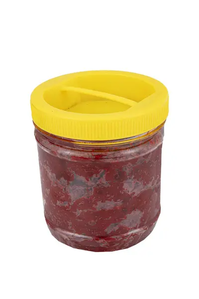 stock image Tomato paste in plastic jar isolated on white background. Plastic container with tomato paste with white background.