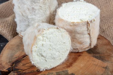 Goats Milk Cheese Tulum Cheese. Tulum cheese is a traditional Turkish goats milk cheese ripened in a goatskin casing. Local name obruk peyniri, Tulum peyniri. clipart