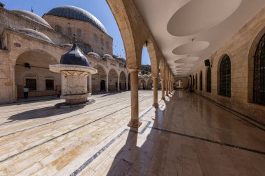 Sanliurfa, Turkey August 4, 2024; Sanliurfa Halilurrahman Mosque courtyard and fountain. Mevlid-i Halil Mosque Sanliurfa, Turkey. clipart