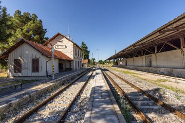 Usak, Turkey July 1, 2023; The historical Inay Train Station, built in 1897, continues to serve those who love train travel today. Inay Train Station, Ulubey, Usak, Turkey. clipart