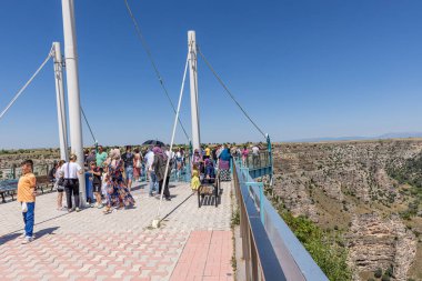 Ulubey, Usak, Turkey July 1, 2023;  Ulubey Canyon glass terrace. Famous place in Turkey travel. Tourists watch the canyon. Ulubey, Usak, Turkey. clipart