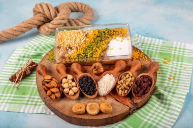 Ashure or Noah's Pudding is a Turkish dessert porridge that is made of a mixture consisting of grains, fruits, dried fruits and nuts. clipart