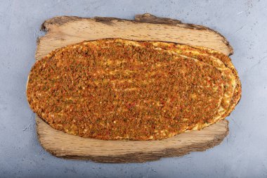 Turkish foods; Turkish pizza, Lahmacun. Turkish delicious cuisine Lahmacun pizza with minced beef or lamb meat, paprika, tomatoes, cumin spice, parsley baked spicy. clipart