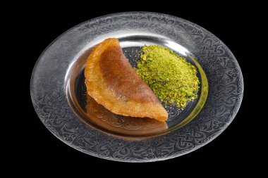 Traditional Turkish dessert called Arab Kadaif or tas kadayif. Turkish Dessert Tas Kadayif with walnuts. clipart