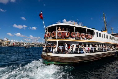 Istanbul Turkey 21 September 2025 ; Eminonu district in Istanbul with passenger ferry near the pier and human crowd, Istanbul. View of the Eminonu Pier Kadikoy. City of Istanbul, Turkey.