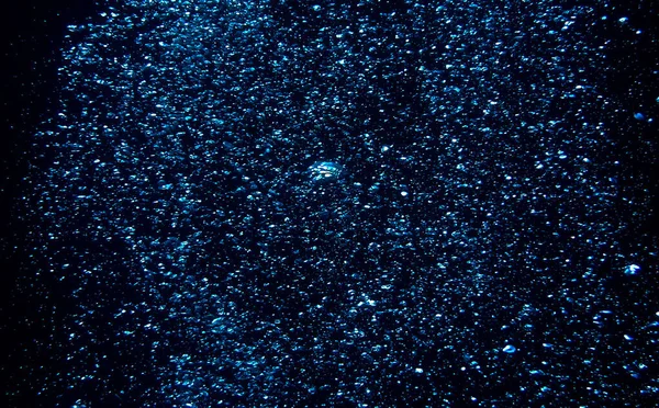 Underwater universe and stars - air bubbles in the deep blue sea