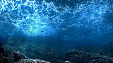 Resifin üzerindeki mavi renkli güneş ışınlarının sualtı fotoğrafı. Tayland 'ın güneyindeki bir dalıştan.. 