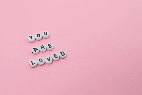 Top View You Loved Quotes Made Out Beads Pink Background — Stock Photo, Image