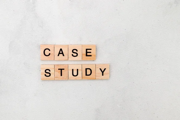 Top view of Case Study word on wooden cube letter block on white background. Business concept
